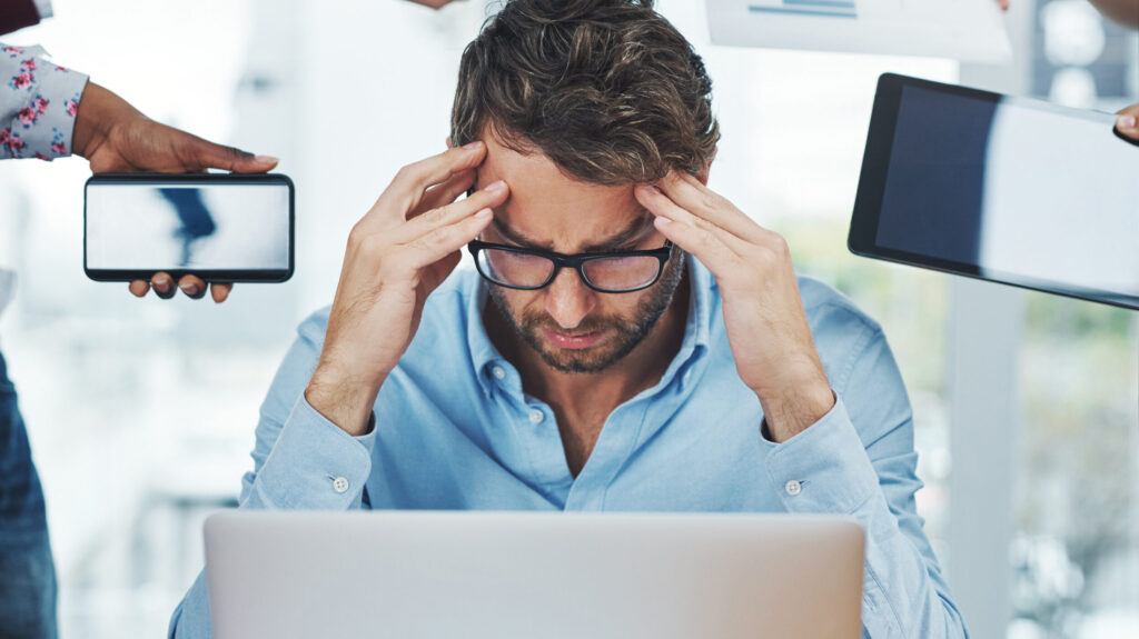 multitask-man-headache-desk-with-deadlines-stress-burnout-laptop-office-businessman-overwhelmed-technology-workplace-with-anxiety-tension-depression-computer